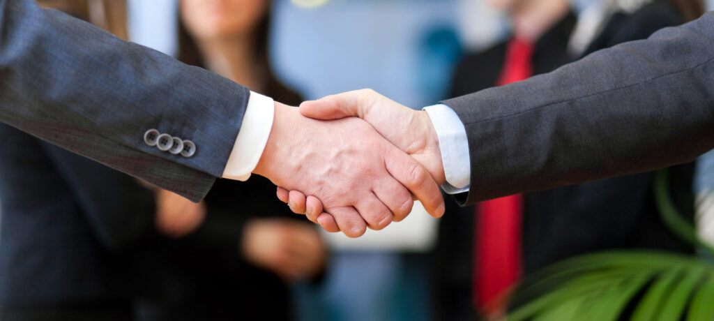 Image of a handshake between business people.