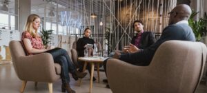 business people at a table, chatting