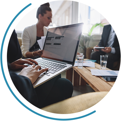 business meeting with view of person's laptop