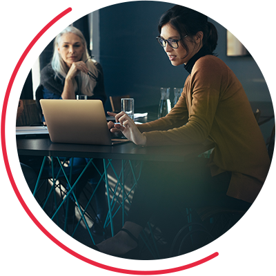 A woman using her computer during a meeting