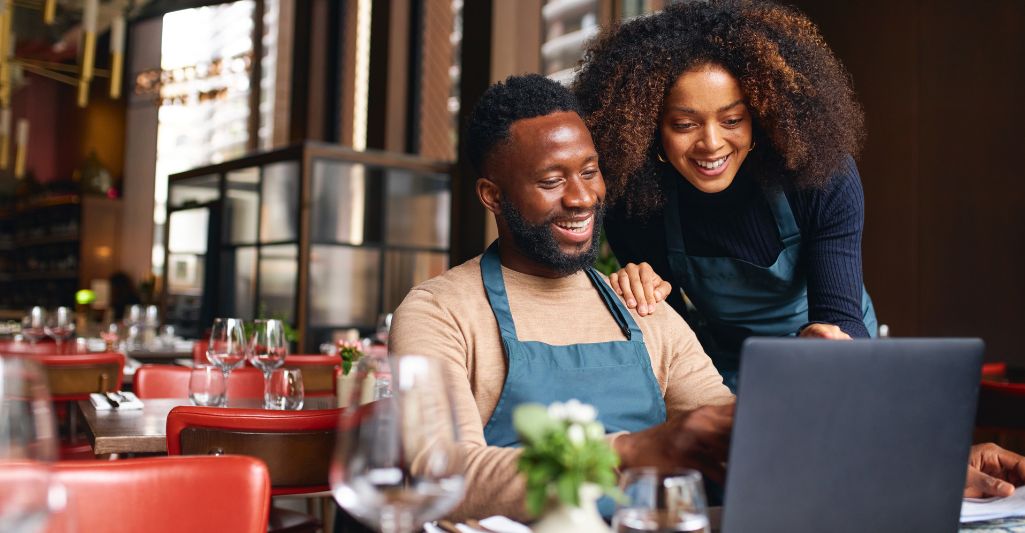 business owners looking at computer