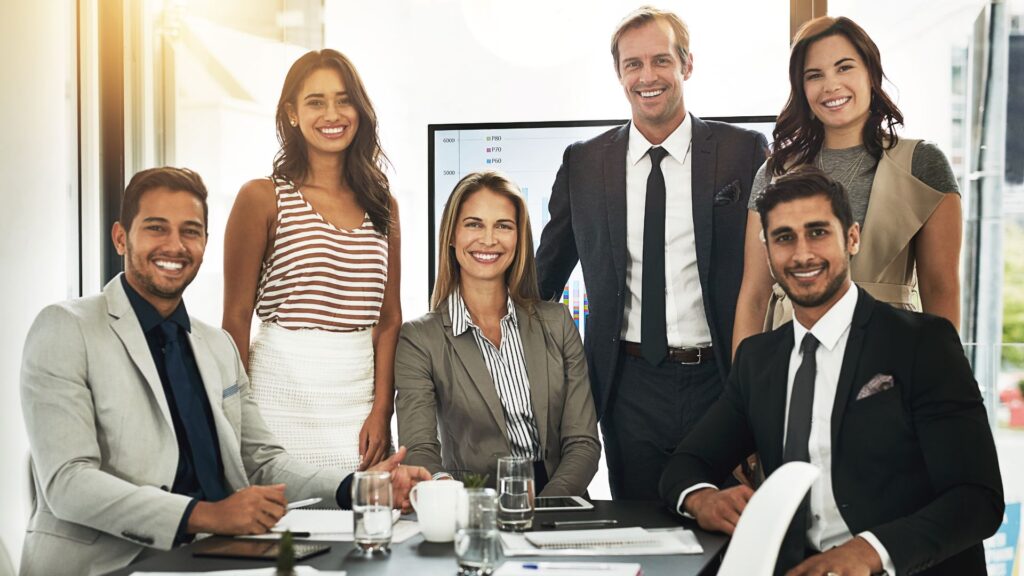 Group of business professionals smiling for a photo