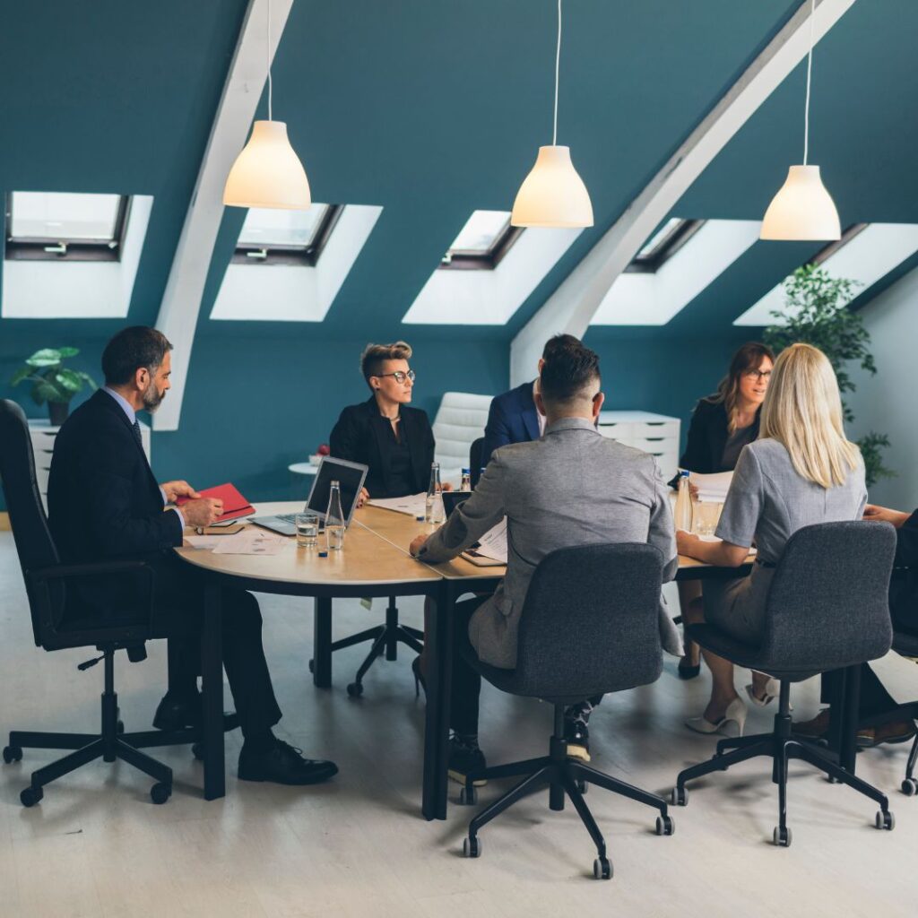 Business professionals having a meeting at a conference table