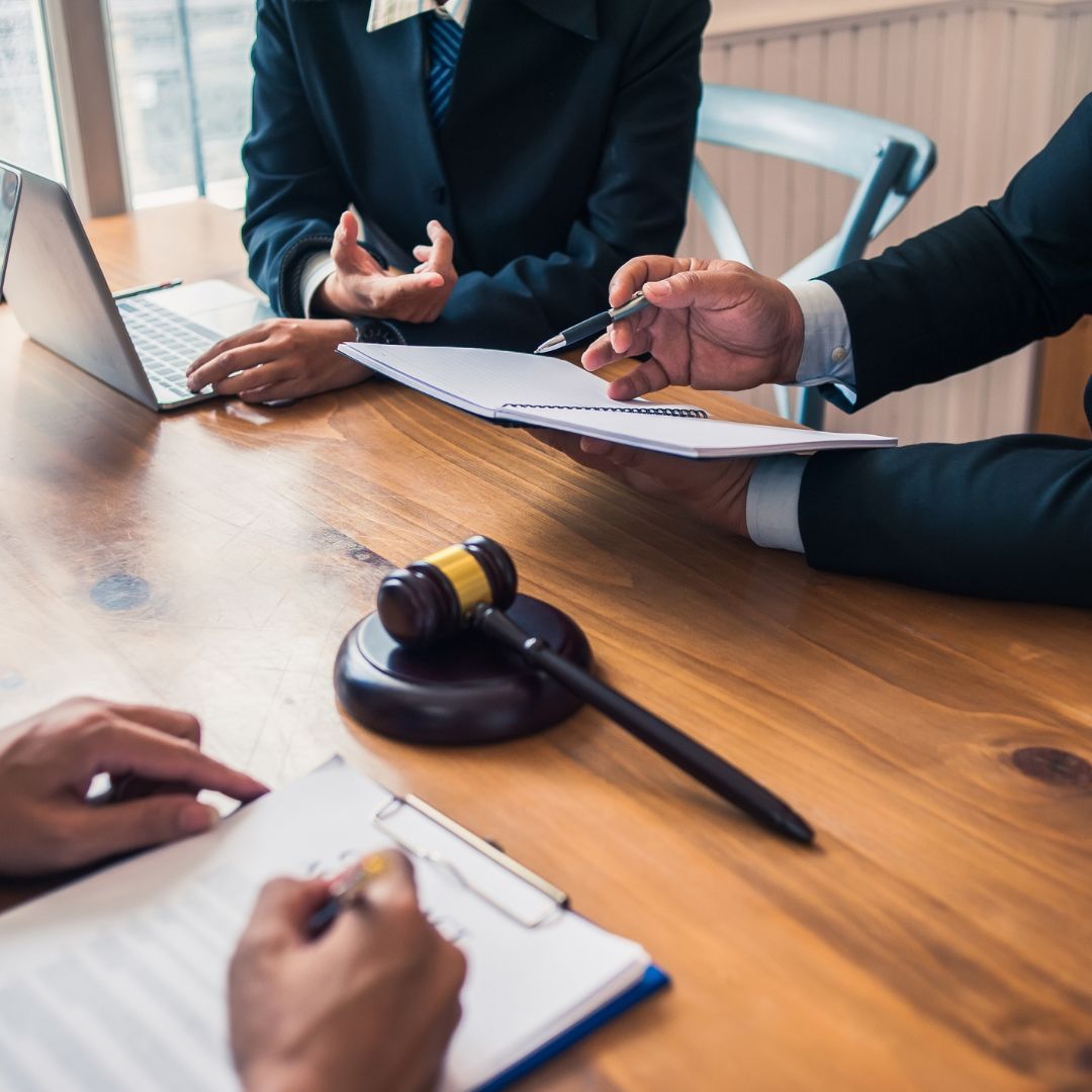 businessmen discussing paperwork