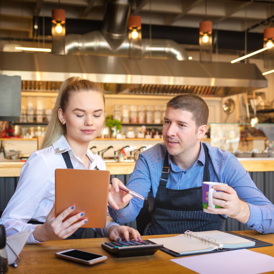 restaurant owners going over expenses