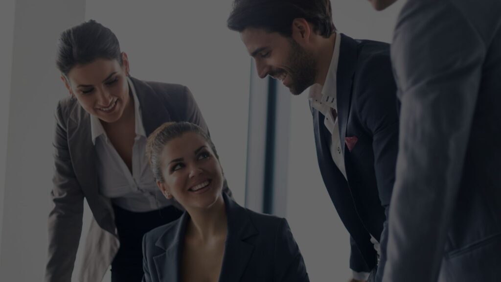 Business co-founders smiling at each other