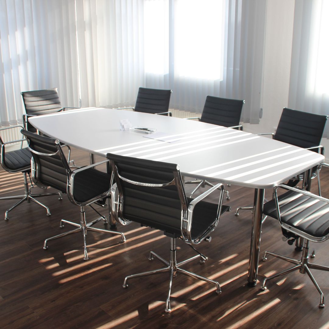 Empty meeting table and chairs