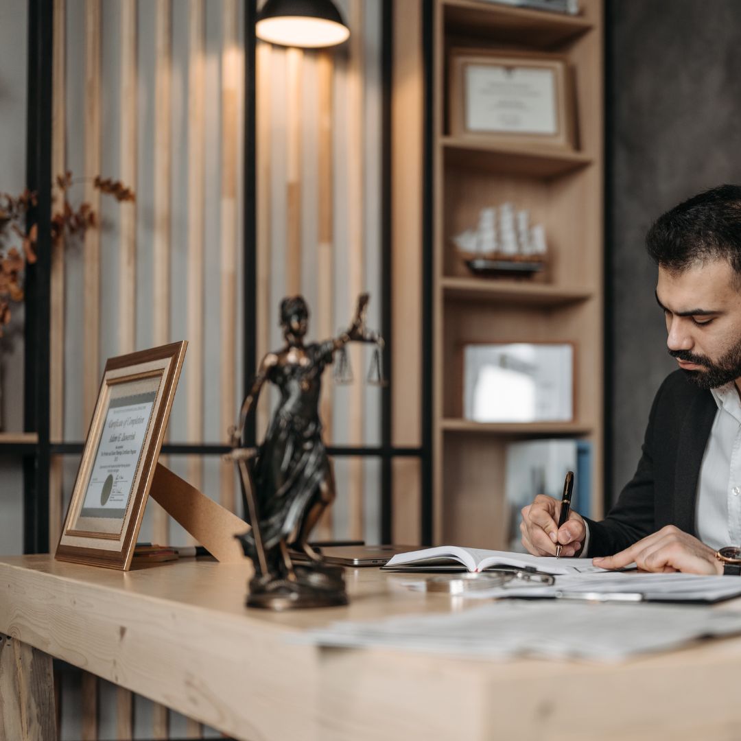 lawyer with credentials on his desk