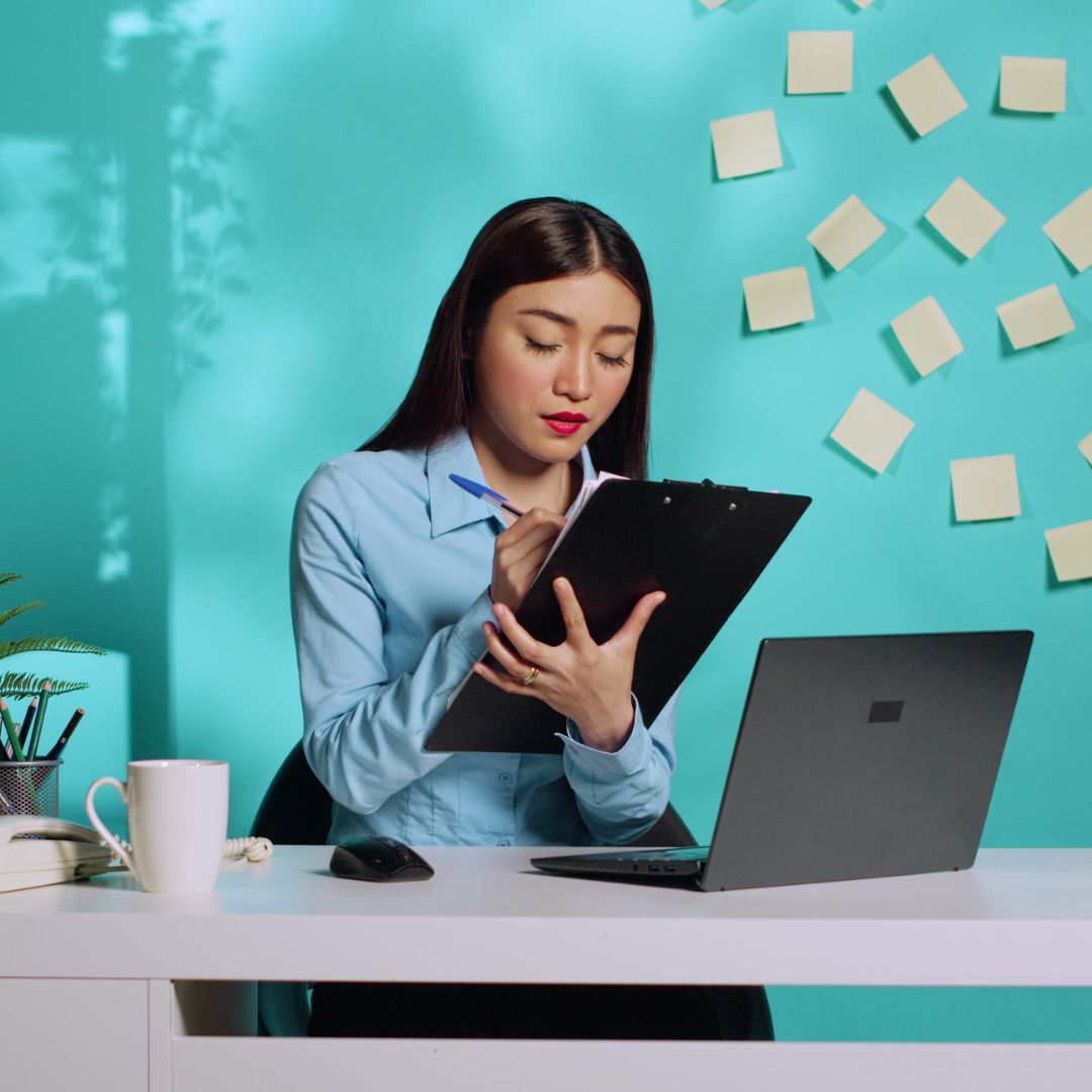 woman taking notes
