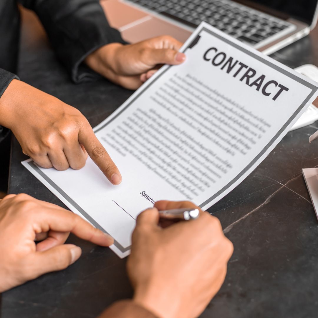 person signing a contract