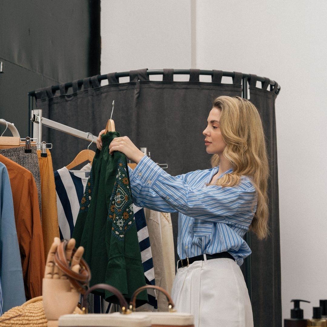 woman hangs clothes up