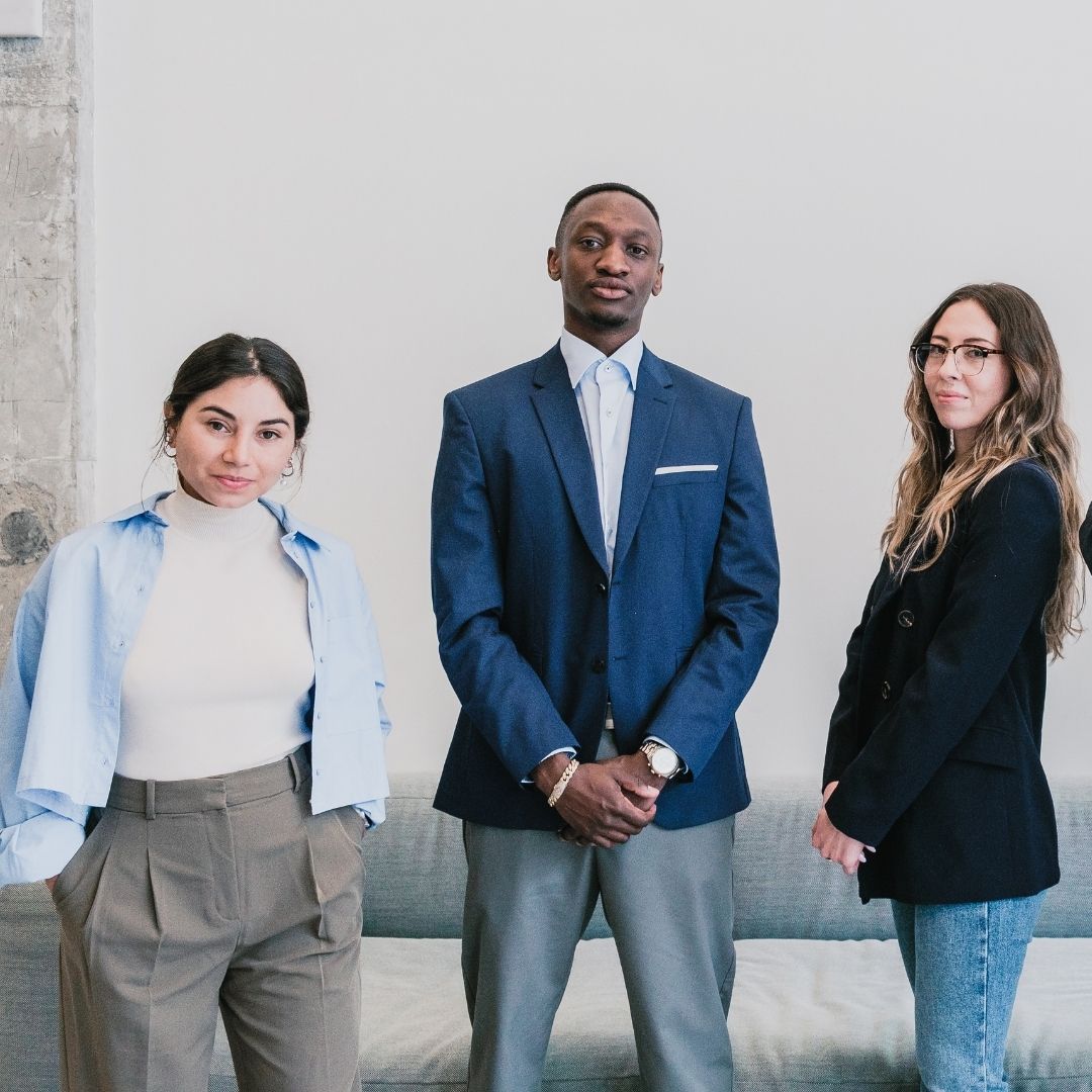people dressed professionally stand in line